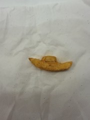 french fry shaped as a boat it is small and yellow