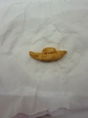 french fry shaped as a boat it is small and yellow
