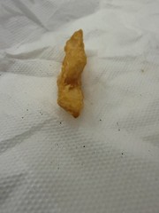 french fry shaped as a boat it is small and yellow
